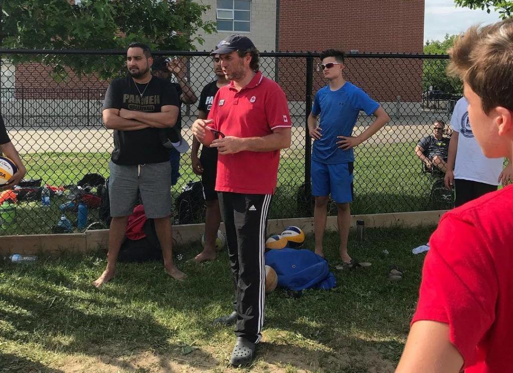 Leonard Krapp Coaching Volleyball to his players